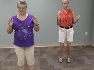 Two women performing Tai Chi