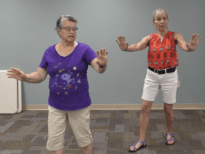 Two women performing Tai Chi